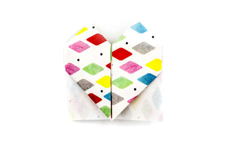 valentine's day concept. origami paper heart made of colorful paper isolated on white backgroundの写真素材