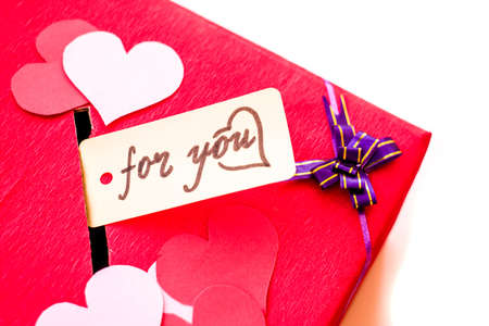 valentine's day holiday. red box for valentines with paper hearts. valentine messages and gift cardsの写真素材