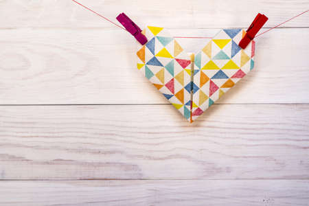 valentine day concept. white origami hearts on white wooden backgroundの写真素材