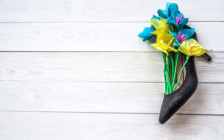 women's day concept. artificial flowers in a shoe as a presentの写真素材