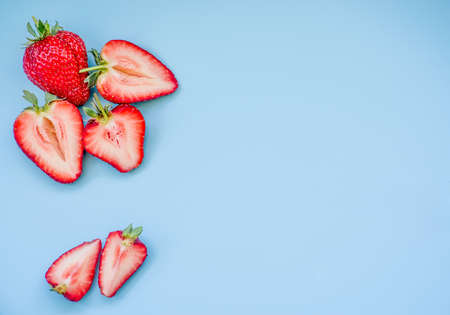 fresh juicy strawberries on blue backgroundの写真素材