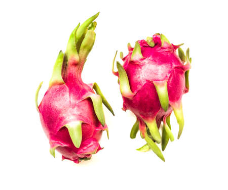 two isolated dragon fruits on white backgroundの写真素材