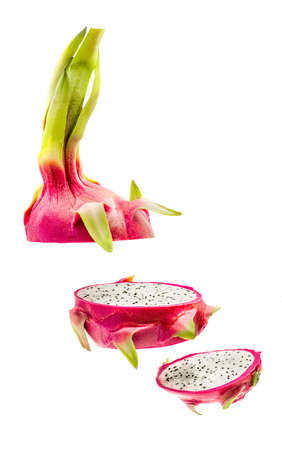 cut dragon fruit slices in the air isolated on white backgroundの写真素材