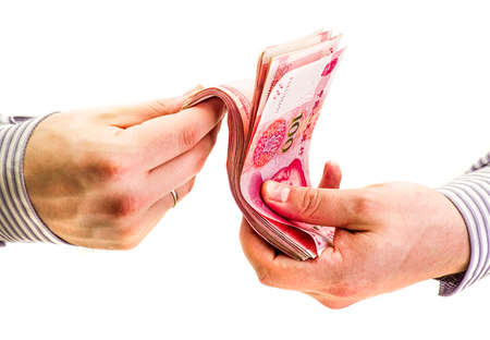 man hands counting chinese yuan bills isolated on white