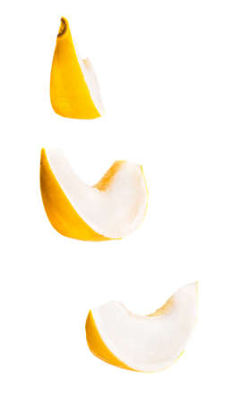 set of melon slices in the air isolated on white backgroundの写真素材