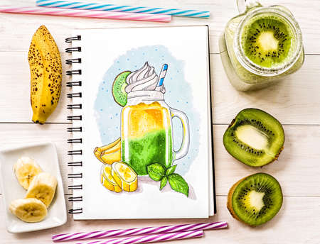 a bright milkshake sketch made with markers decorated with fruit slices on white wooden background. a hand-drawn illustration wth milkshake in mason jar ina sketchbook decorated with a milkshake cocktail, kiwis,bananas and drinking straws on white wood backgroundの写真素材