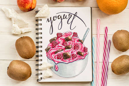 a bright yogurt hand-drawn illustration made with markers decorated with fruits and drinking straws on white rustic backgroundの写真素材