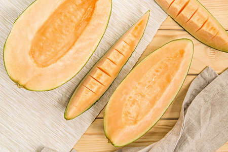 various melon slices on napkins on rustic backgroundの写真素材