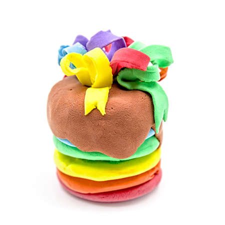 creative plasticine cake craft isolated on white. hand made fake clay craftの写真素材