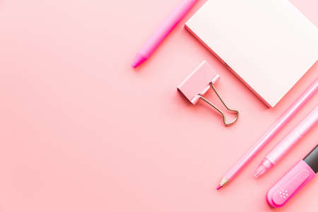 pink stationery on pink background top view flat layの写真素材