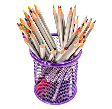 back to school concept. colored pencils in a metal pen container isolated on white backgroundの写真素材