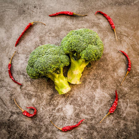 healthy food concept. Fresh vegetables and nuts layout on dark background top view flat lay. Creative layoutの写真素材