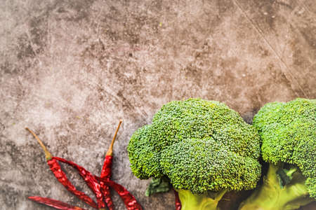 healthy food concept. Fresh vegetables and nuts layout on dark background top view flat layの写真素材