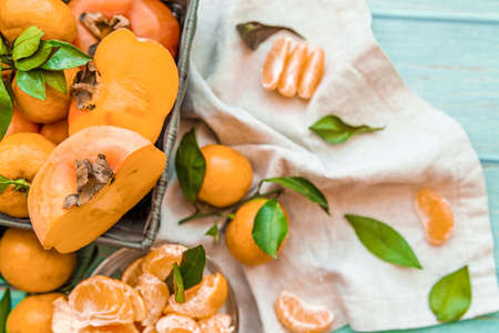 fresh ripe persimmons isolated on white backgroundの写真素材
