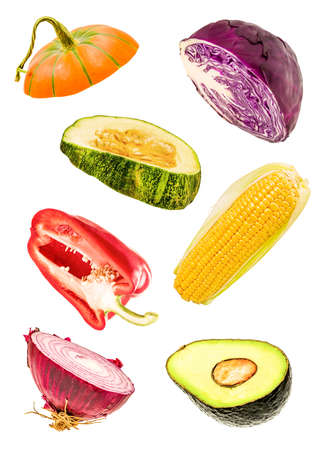 isolated slices of vegetables. falling cut onions, pumpkin, corn, avocado, bell pepper and red cabbageの写真素材