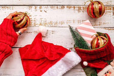 Christmas decorations and presents on white wooden backgroundの写真素材