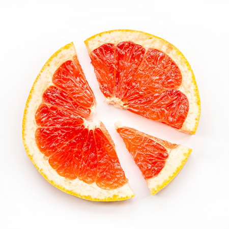 grapefruit slice forming a diagramm top view on white backgroundの写真素材
