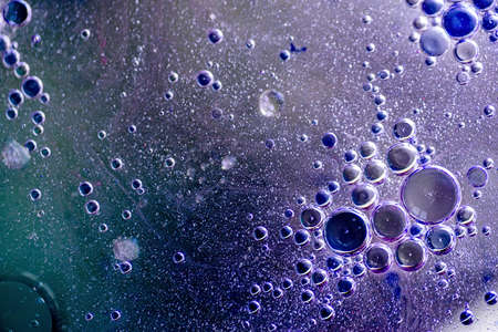 Abstract background or texture with oil bubbles motion on water surfaceの写真素材