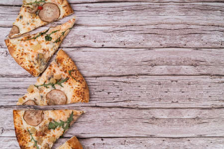 Pizza slices with blue cheese and pear flat lay top view on wooden backgroundの写真素材