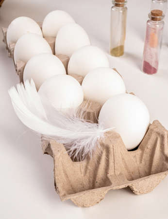 Easter hioliday concept. Carton of eggs on the table ready for coloring