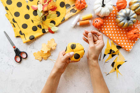 Step by step instruction of making halloween textile DIY pumpkin craft.