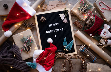 Zero waste and eco friendly christmas concept. Letter board with the words Merry Christmas and new year decorations top view flat layの写真素材