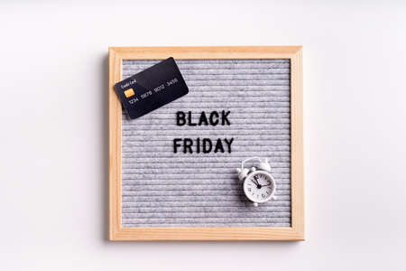 Black friday, seasonal sale concept. Text black friday on gray letter board on white backgroundの写真素材
