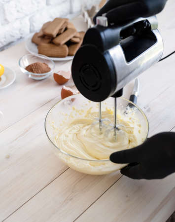Cooking a homemade tiramisu cake high angle viewの写真素材