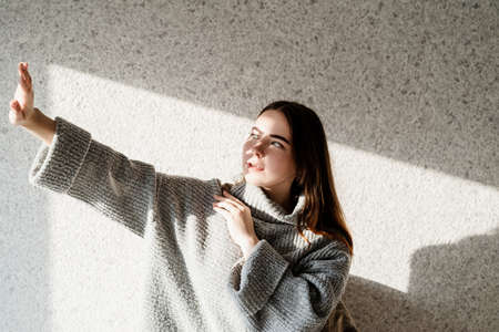 Light and shadow portrait. Beautiful young woman with a shadow pattern on the face. Hard light....