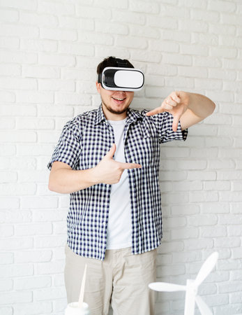 Engineer or designer using VR glasses visualising reneable energy project