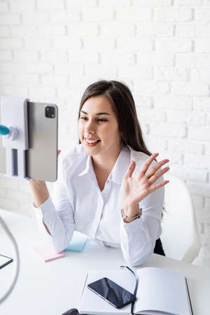 Distance learning. E-learning. Business woman working online talking on the phone