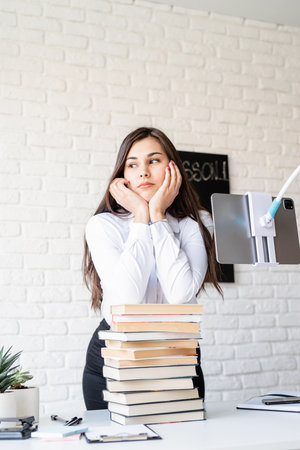 Distance learning. E-learning. Business woman working online talking on the phone
