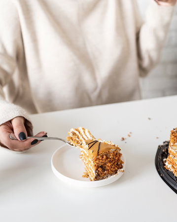 woman eating cake at home