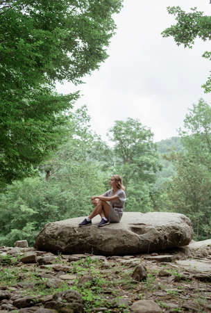 woman enjoying nature in tropical forest