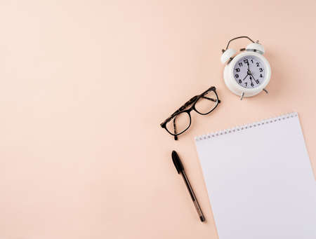 Top view desk arrangement. Time management, planning concept. Blank calendar for mockup, glasses,...