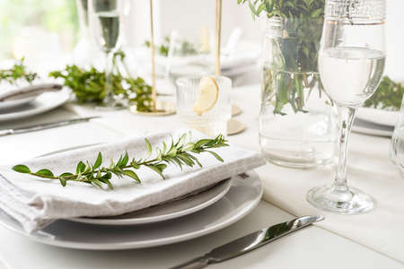 Wedding table set up in traditional style with roses and greenery. Wedding table landscapes, front...