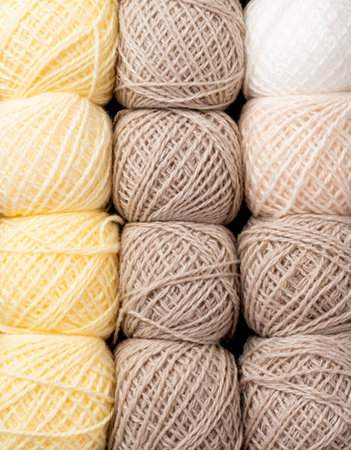 pastel colored yarn wool on shopfront. Knitting background, a lot of balls. Knitting yarn for...