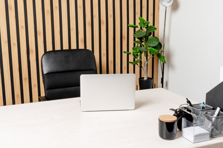 Laptop on working table at office space