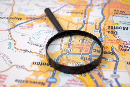 concept of travel. Map of the USA and magnifying glass.