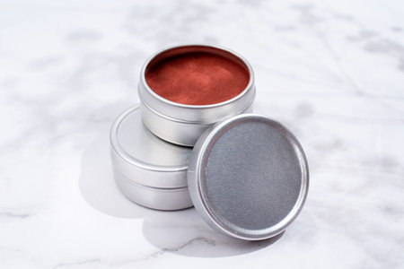 colorful lip balms in round tin cases on light background with shadow overlay, mockup design, labelの写真素材