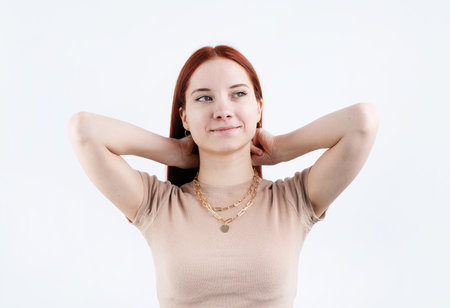 Women wearing jewelry gold pendant necklace on white backgroundの写真素材