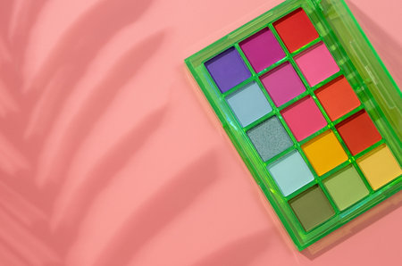 Bright summer eyeshadow palette with greens and redsの写真素材