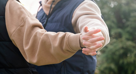 Outdoor photo of happy young woman enjoying date. cheerful romantic couple dating, holding hands