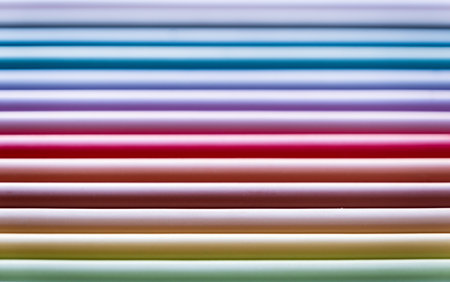 set of pastel colored colorful pencils, colorful backgroundの写真素材