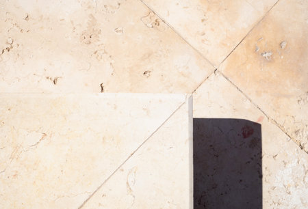 closeup top view of marble stairs with harsh shadow, geometric abstract building detailsの写真素材