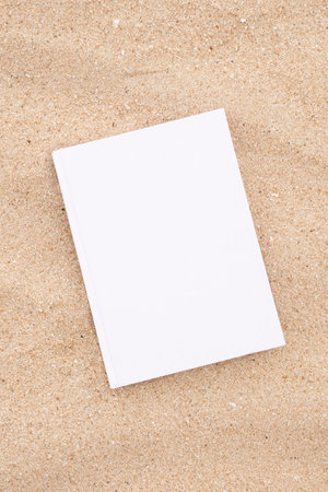 book mockup design. reading on vacation. blank book mockup on sandy beach