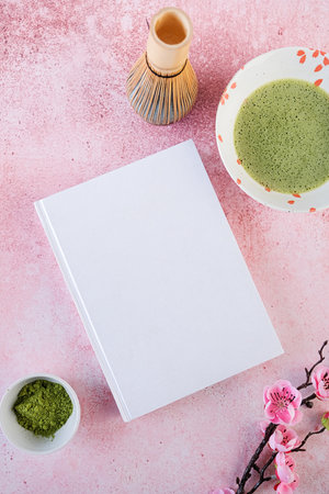 blank book mockup on pink table with green matcha tea, Asian style