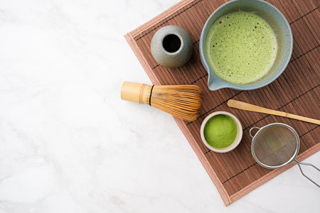 making green matcha tea during the Japanese ceremony. Traditional kit, Bamboo whiskey and beverage...