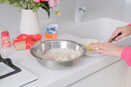 Valentines day concept. Mothers day. Millennial brunette woman making valentine cookies in the...