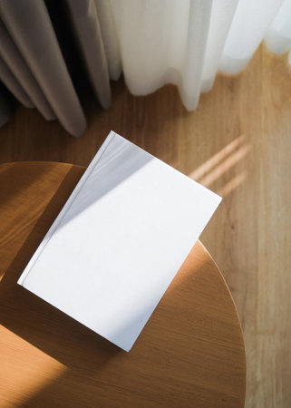 blank book mockup on wooden coffee table , shadow overlay